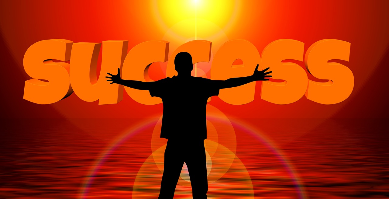 University of New Hampshire logo featuring blue shield and letters.